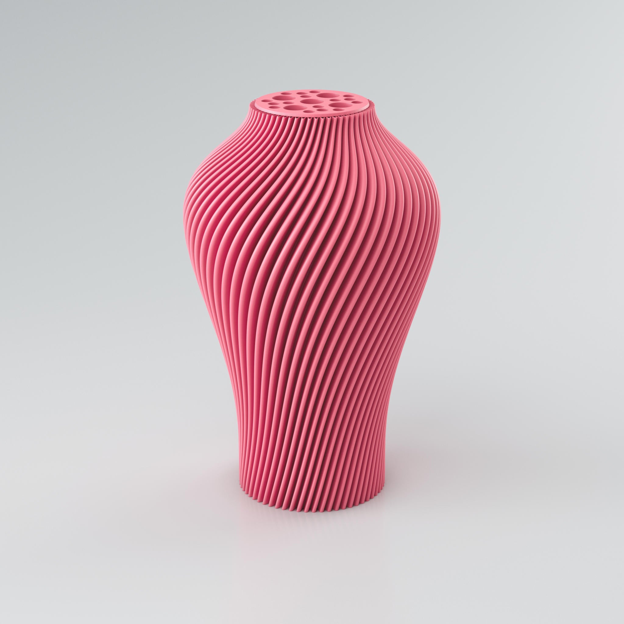 Eine hohe, skulpturale Vase in einem gedämpften Taupe-Ton steht auf einem hellgrauen Hintergrund. Die Vase hat eine ausgeprägte, spiralförmige Rippenstruktur, die sich von der Basis bis zum Hals windet und ein dynamisches Licht- und Schattenspiel erzeugt. Der Hals der Vase ist leicht verengt und mit einer runden Platte versehen, die mehrere unregelmäßig geformte Öffnungen aufweist, ideal für Trockenblumen. Die Oberfläche der Vase wirkt modern und konstruiert, mit klaren Kanten, die ihre architektonische...