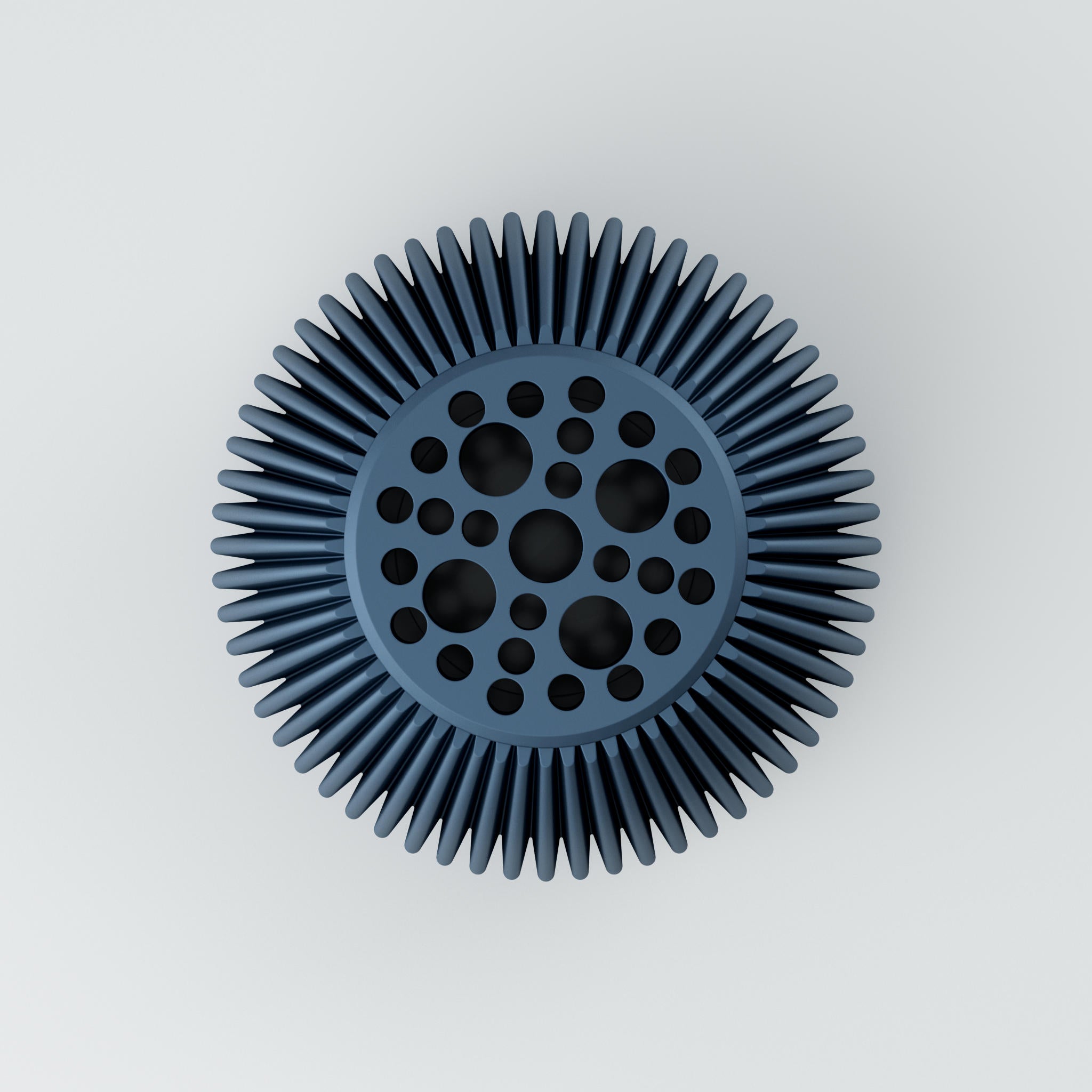 Zahnradartige Scheibe aus blau-grauem Material mit runden Bohrungen und radialen Zähnen vor hellem Hintergrund.