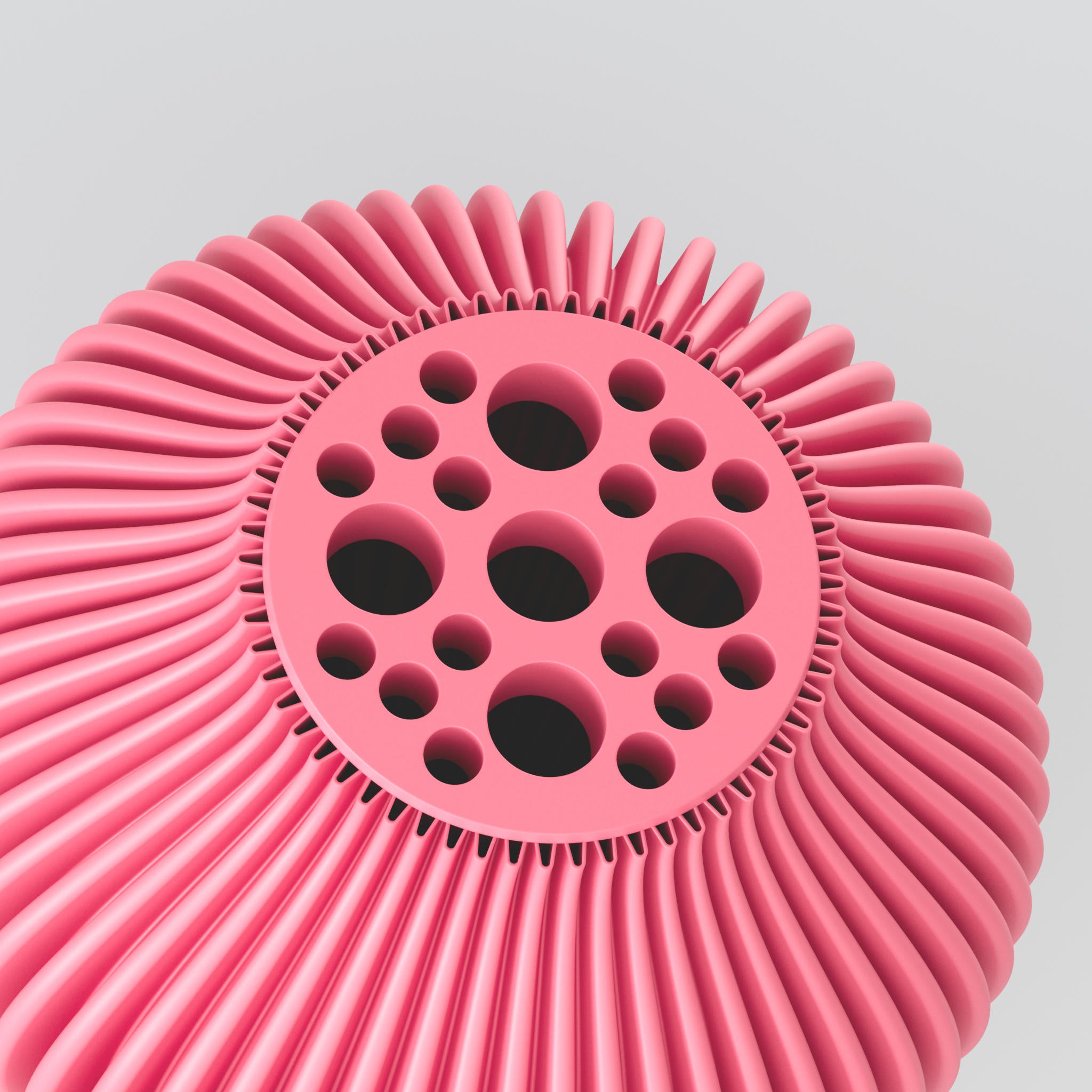 Rundes pinkes 3D-Objekt mit kugeligen Aussparungen und ringförmigen Rippen vor grauem Hintergrund.