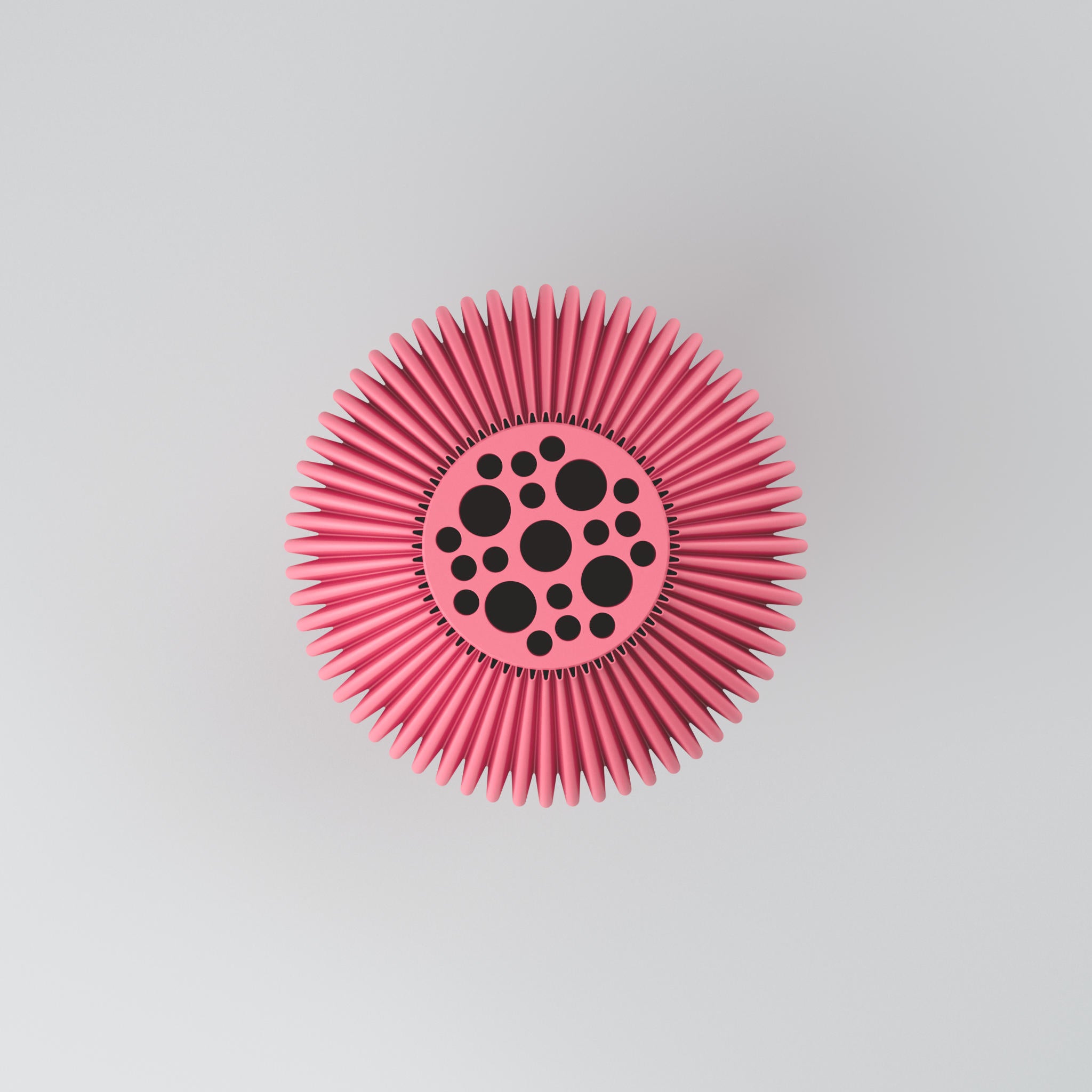 Rosafarbener Igelball mit spitzen Borsten und schwarzen Punkten in Kreismitte vor hellem grauem Hintergrund.